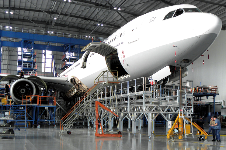 Aircraft maintenance in hangar with platform | © n/a